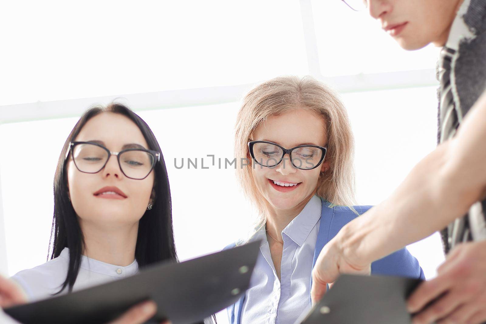 image of a modern business team discussing new ideas. the concept of teamwork