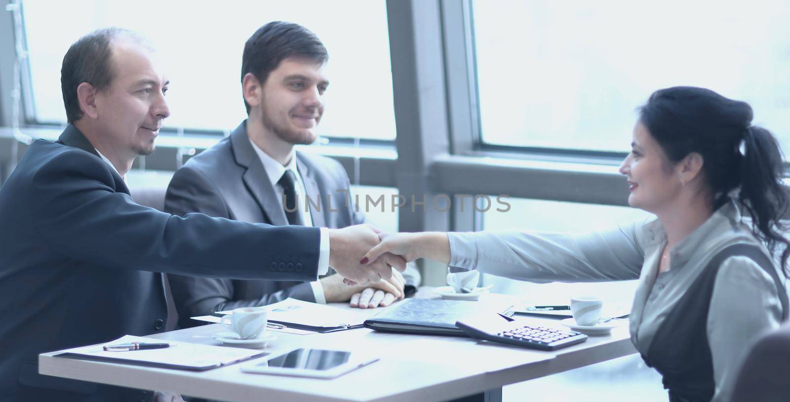 handshake Manager and the client over a Desk by SmartPhotoLab