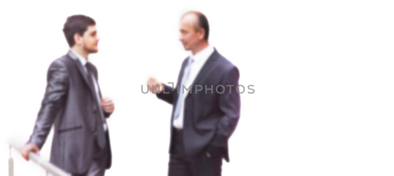 business colleagues discussing business issues. office weekdays. blurred image for the advertising text.