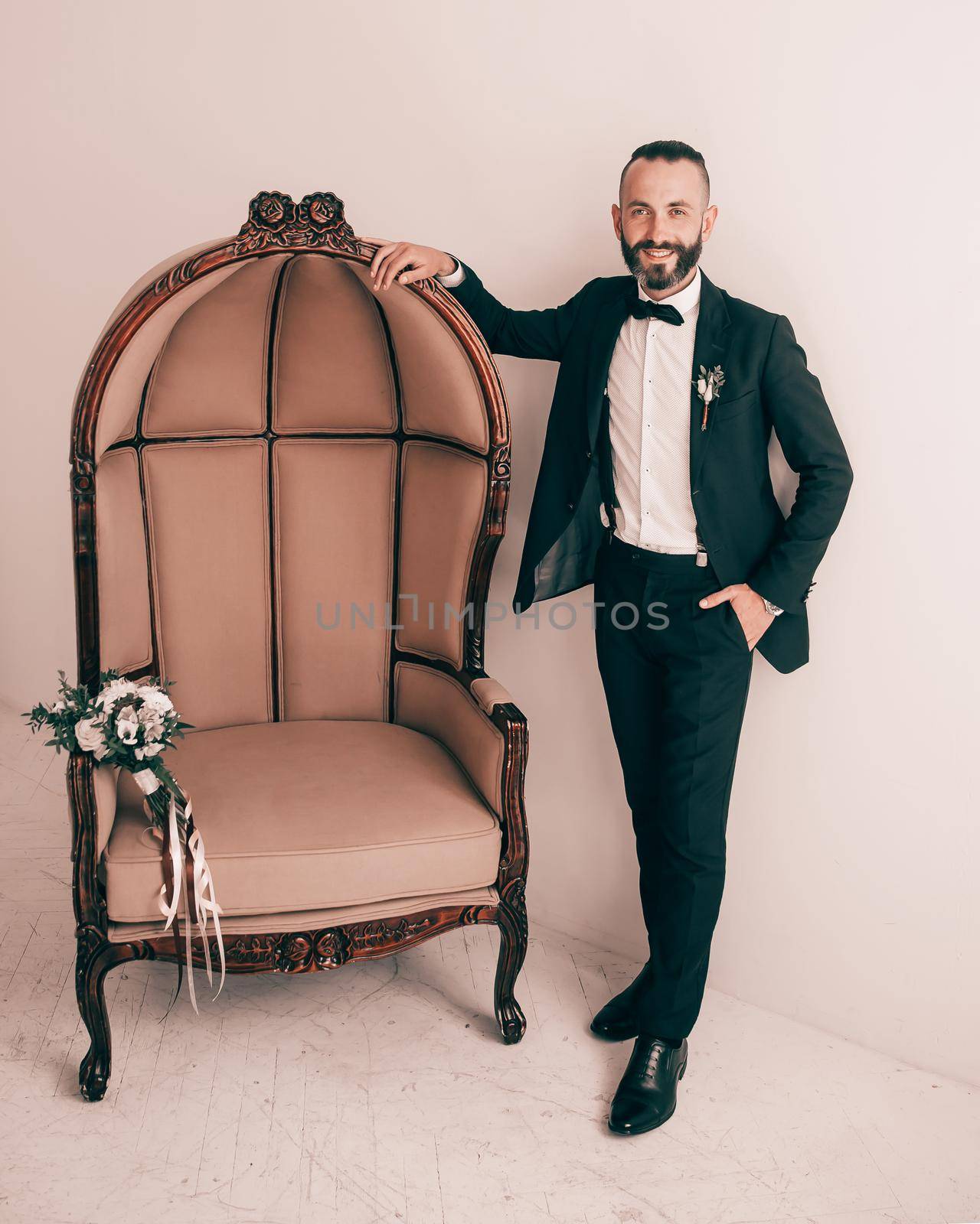 portrait of an elegant man in a wedding suit. photo with copy space