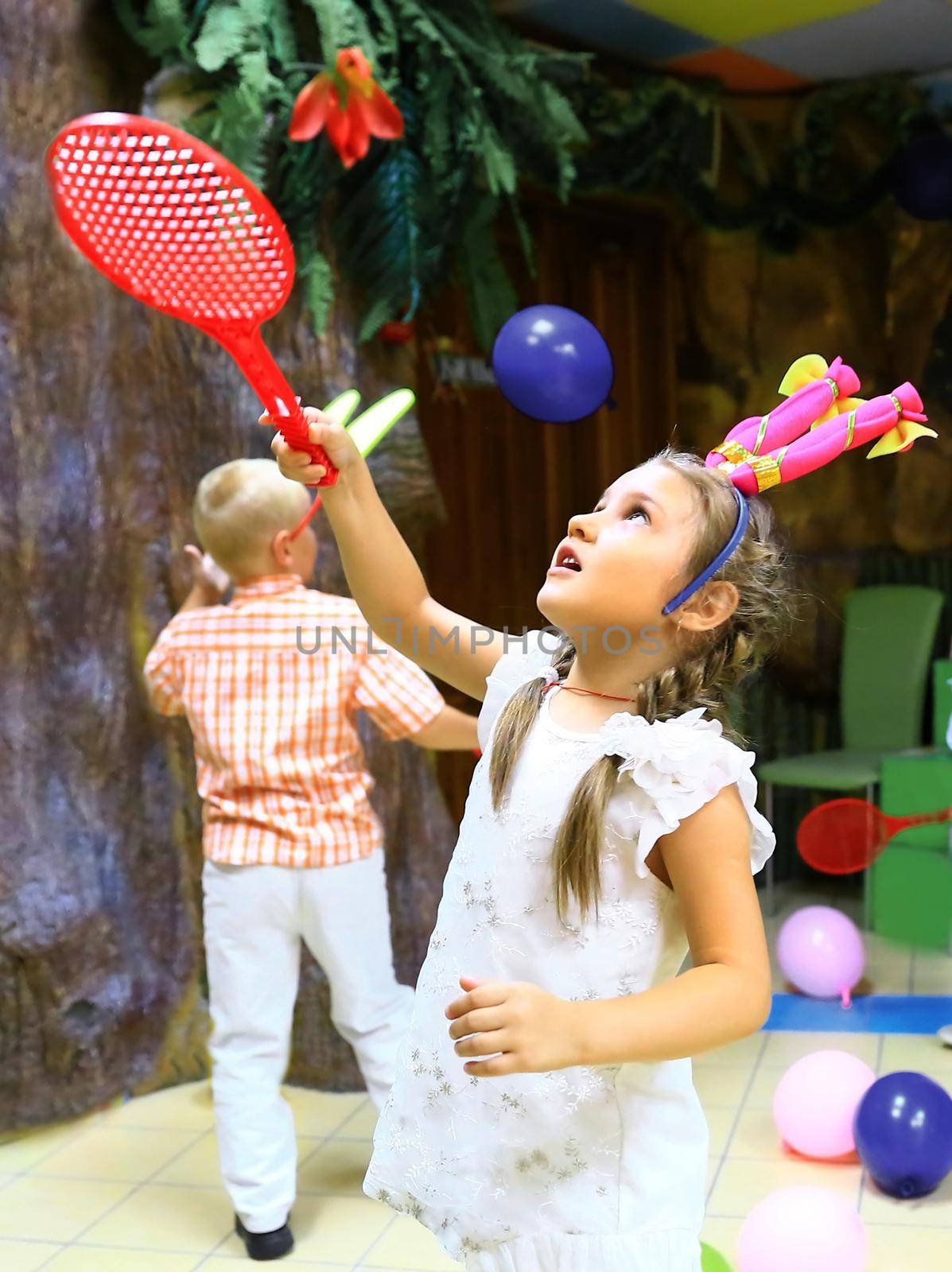 little girl playing in a children's entertainment center.holidays and events