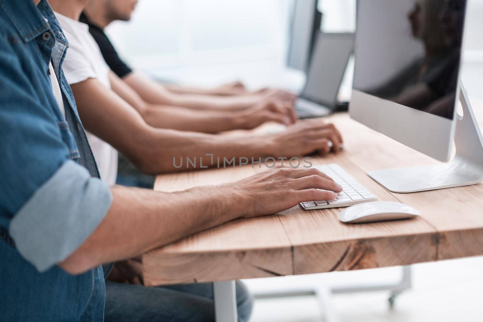 close up. a group of people work on their computers. business and education