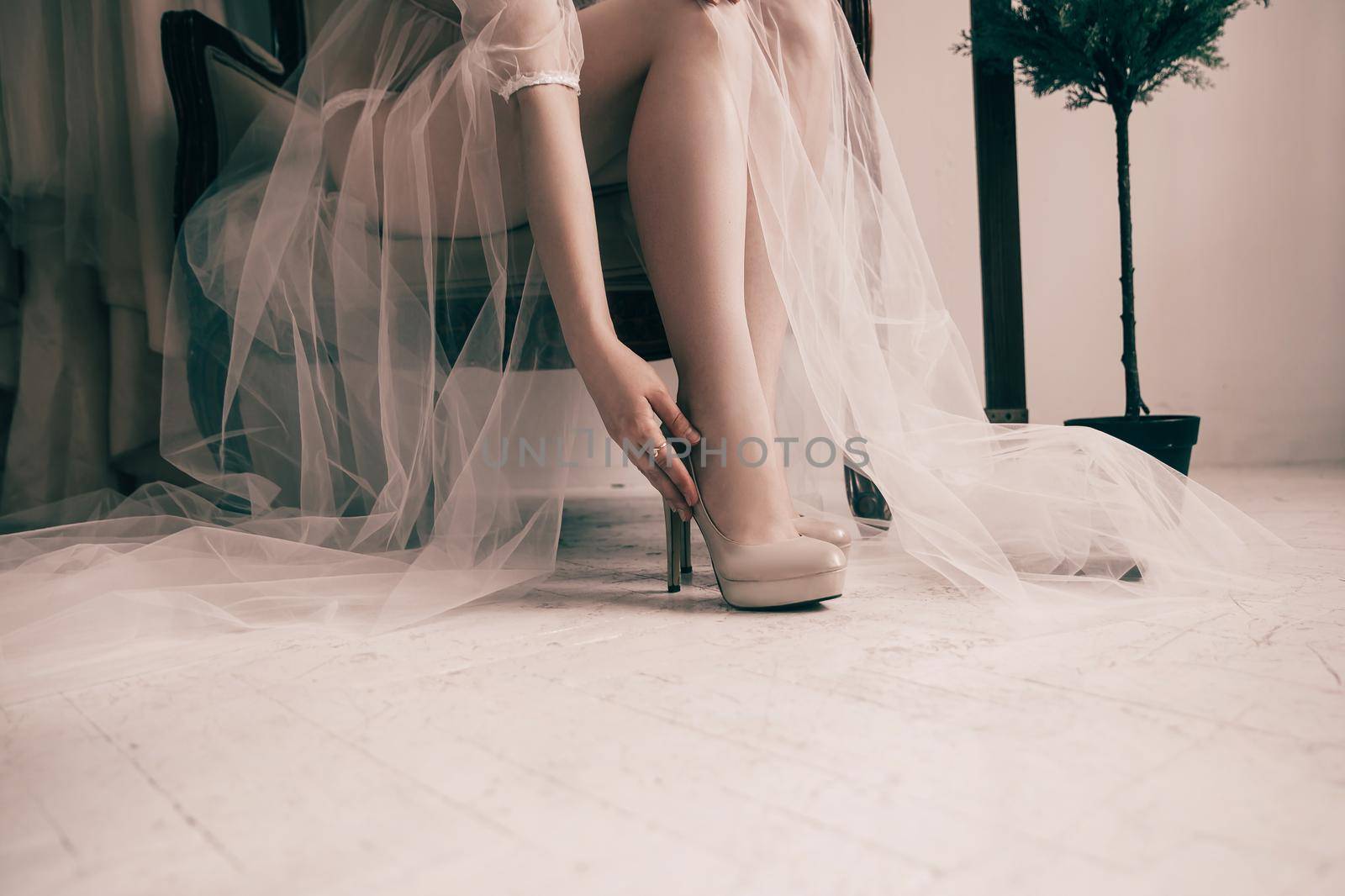 close up. bride trying on elegant wedding shoes. photo with copy space
