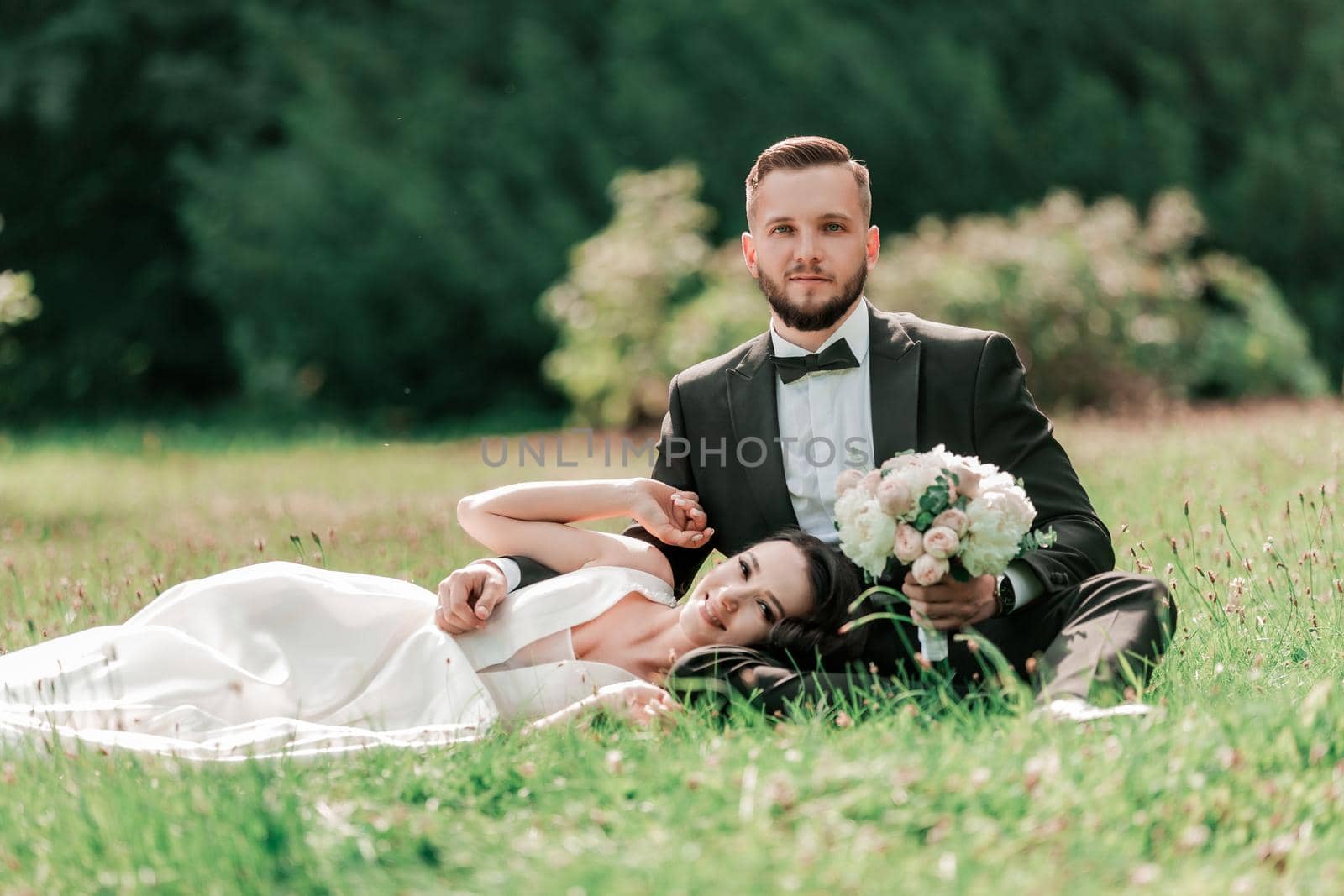 couple in love on the lawn in the summer Park. by SmartPhotoLab