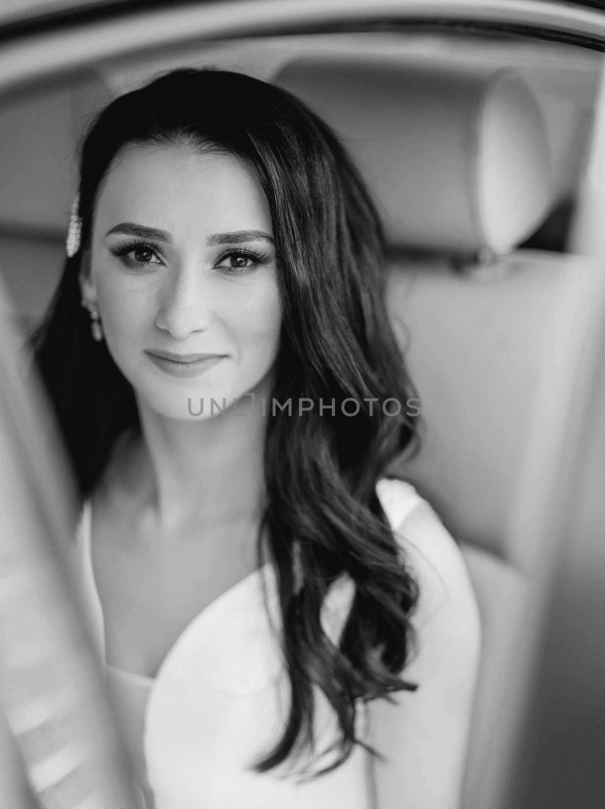 close up. attractive bride sitting in a chic car