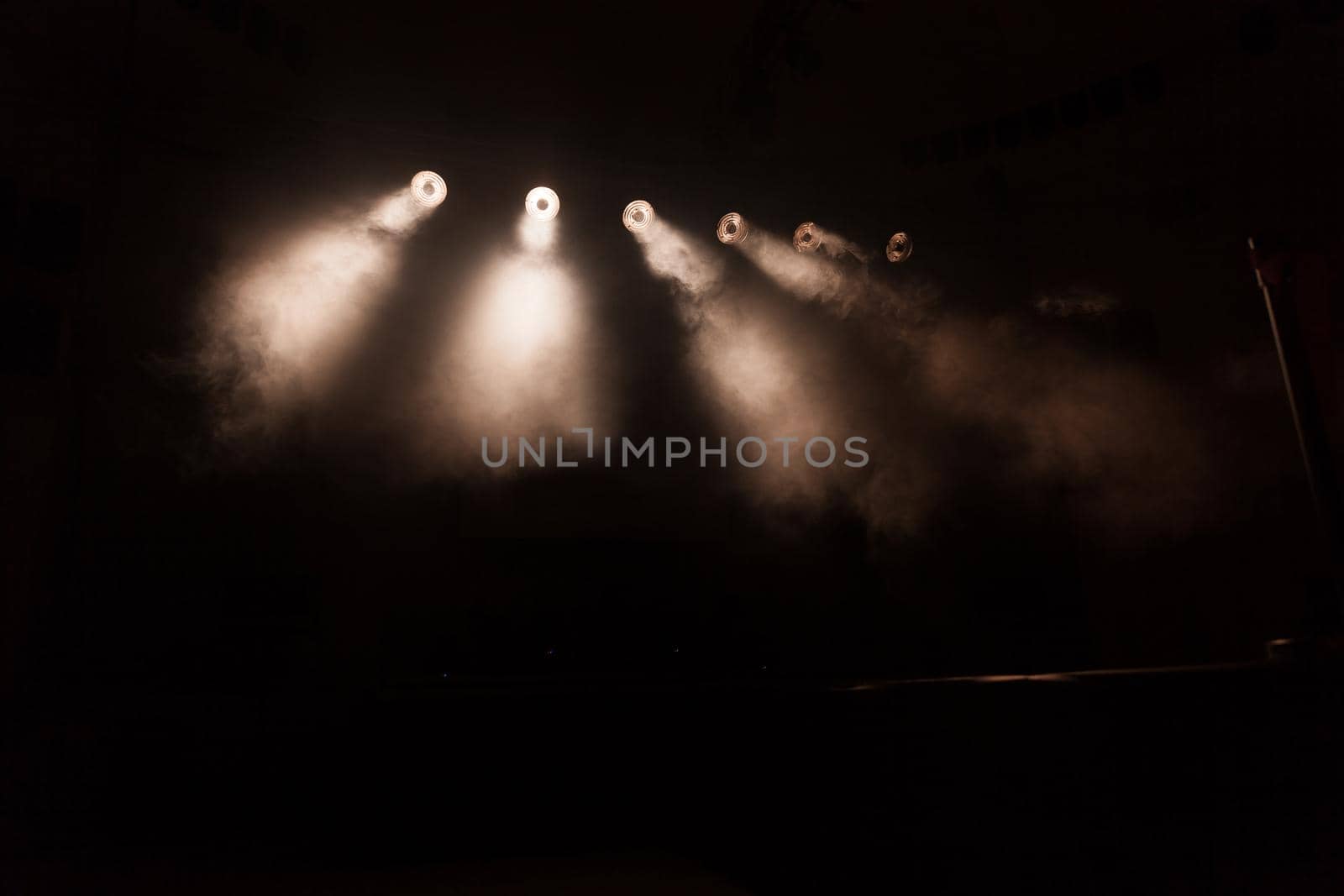 bright spotlights in the dark.photo with copy space