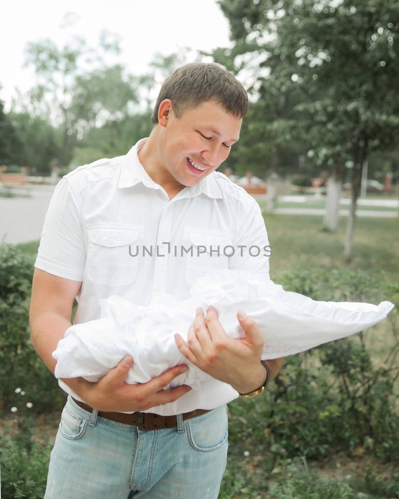 close up. happy father with his newborn baby standing on city street