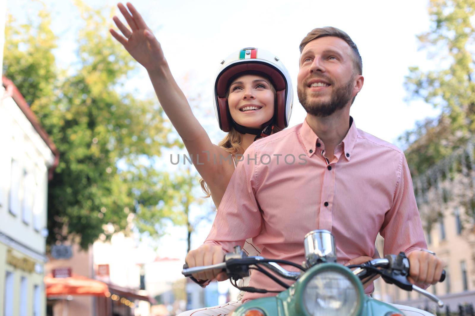 Young beautiful couple riding on motorbike. Adventure and vacations concept. by tsyhun
