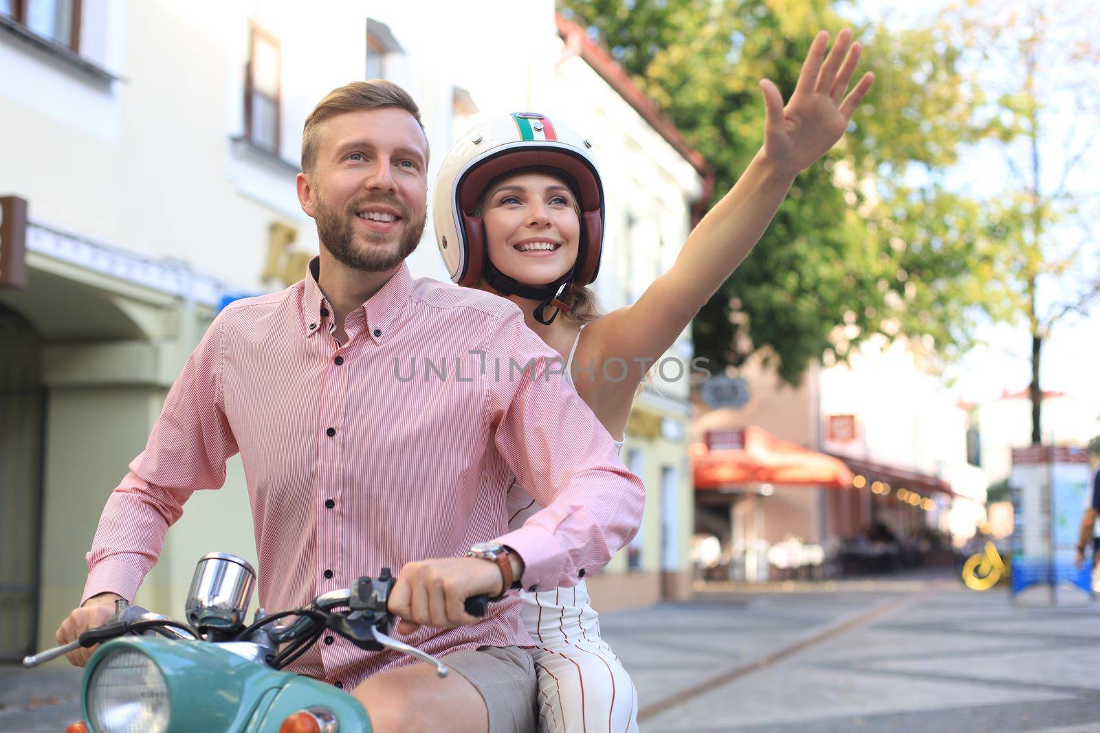 Young beautiful couple riding on motorbike. Adventure and vacations concept. by tsyhun