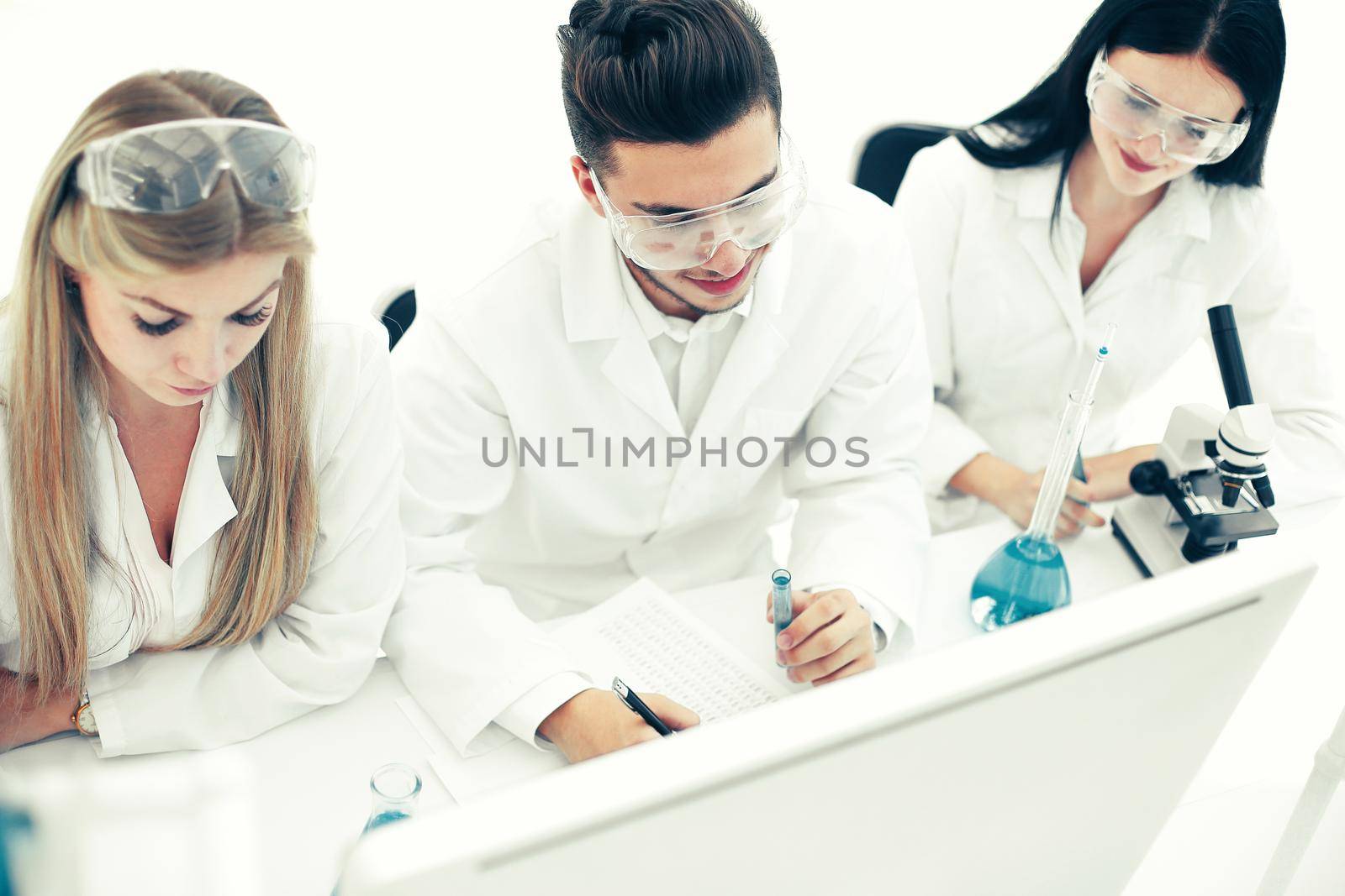 top view.a group of scientists working on a computer in the laboratory . science and health