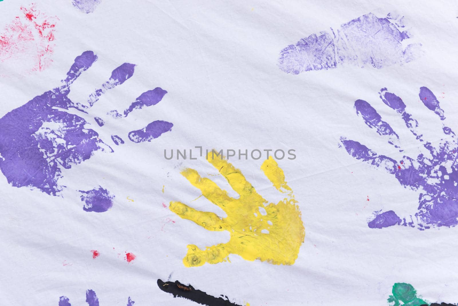 child colorful hands and foots print on white background