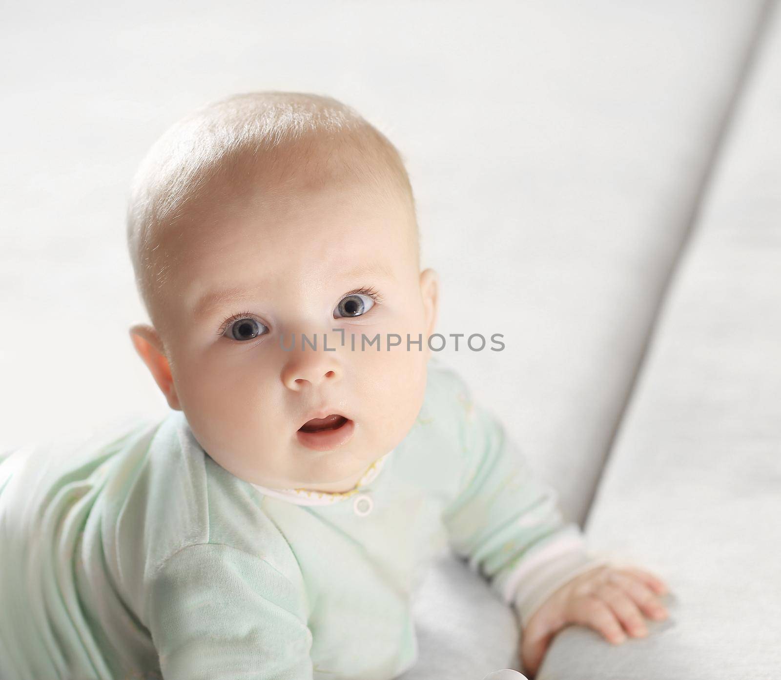 close-up of a pretty little baby looking at the camera.photo with copy space.