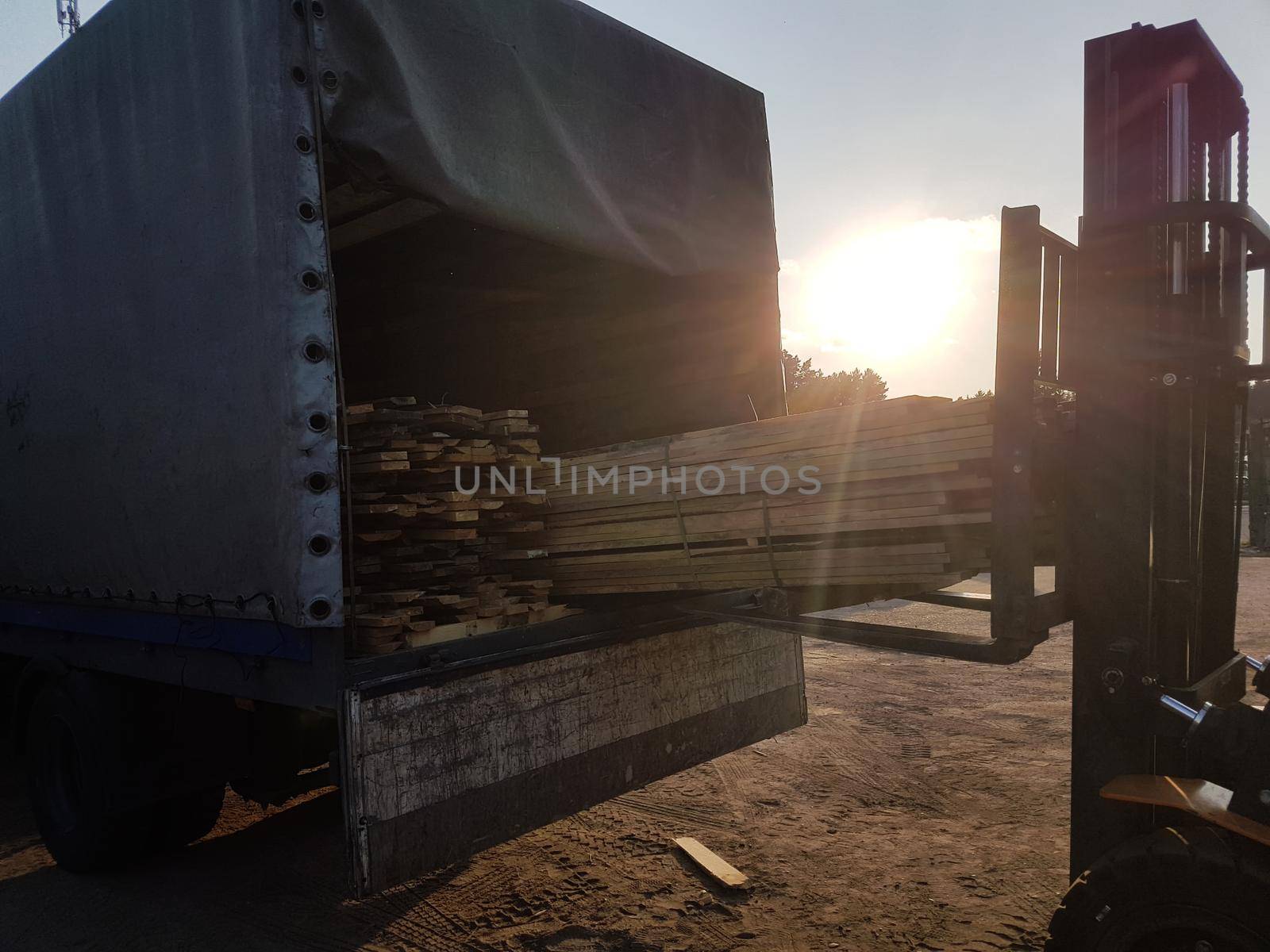 close up. loading wooden boards in a truck. photo with copy space