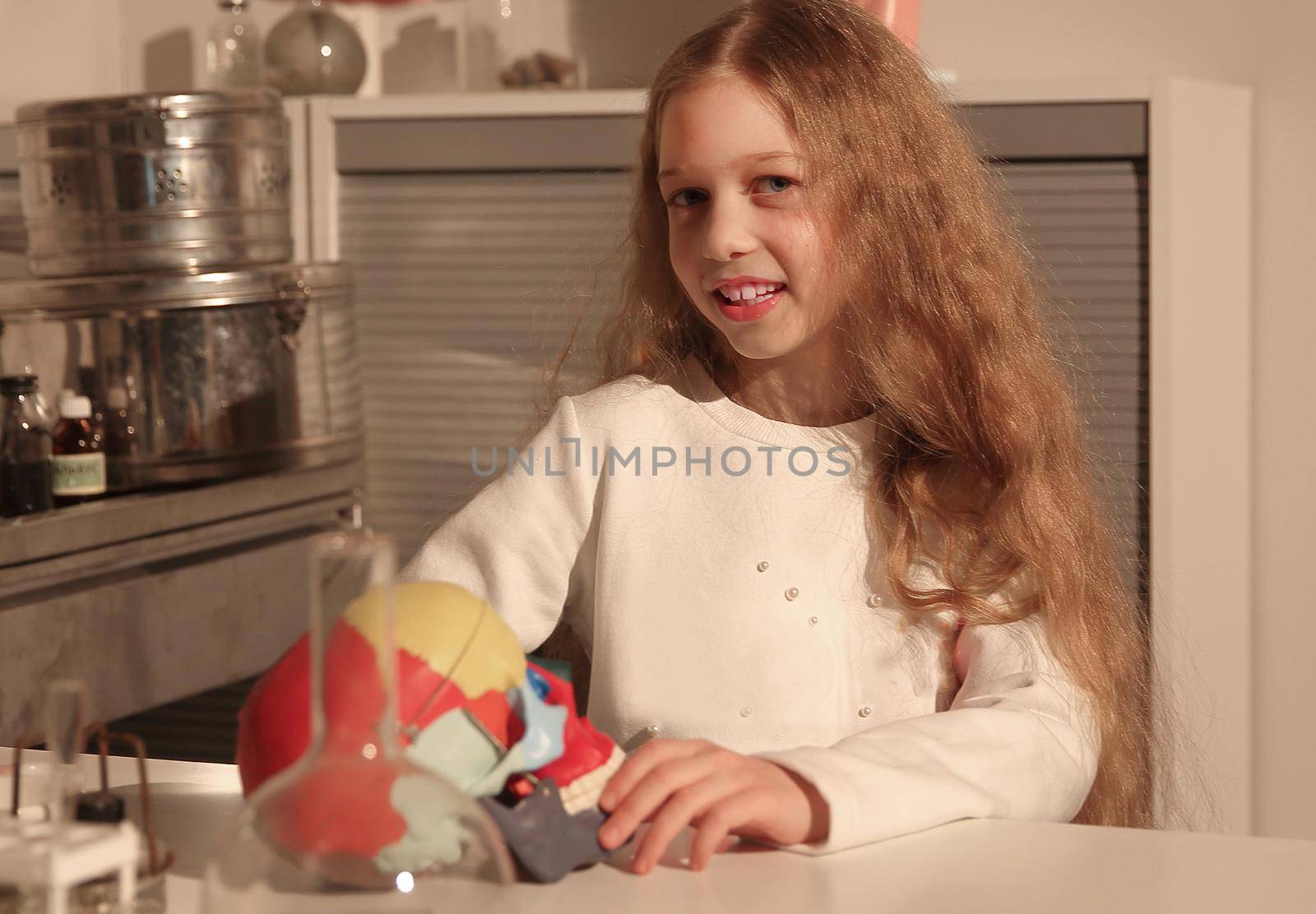 teenage girl conducting research in the school laboratory. the concept of education and hobby