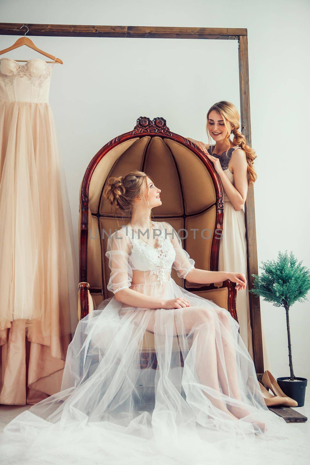 bride in wedding salon trying on wedding dress. holidays and events