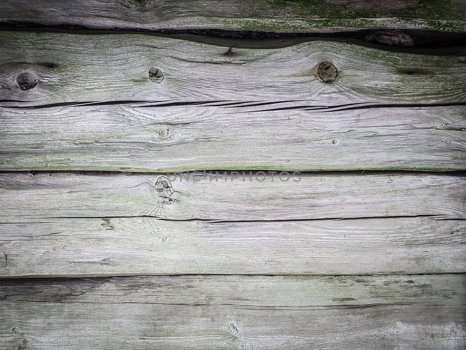 close up. a fragment of the wall of a wooden barn. background and texture