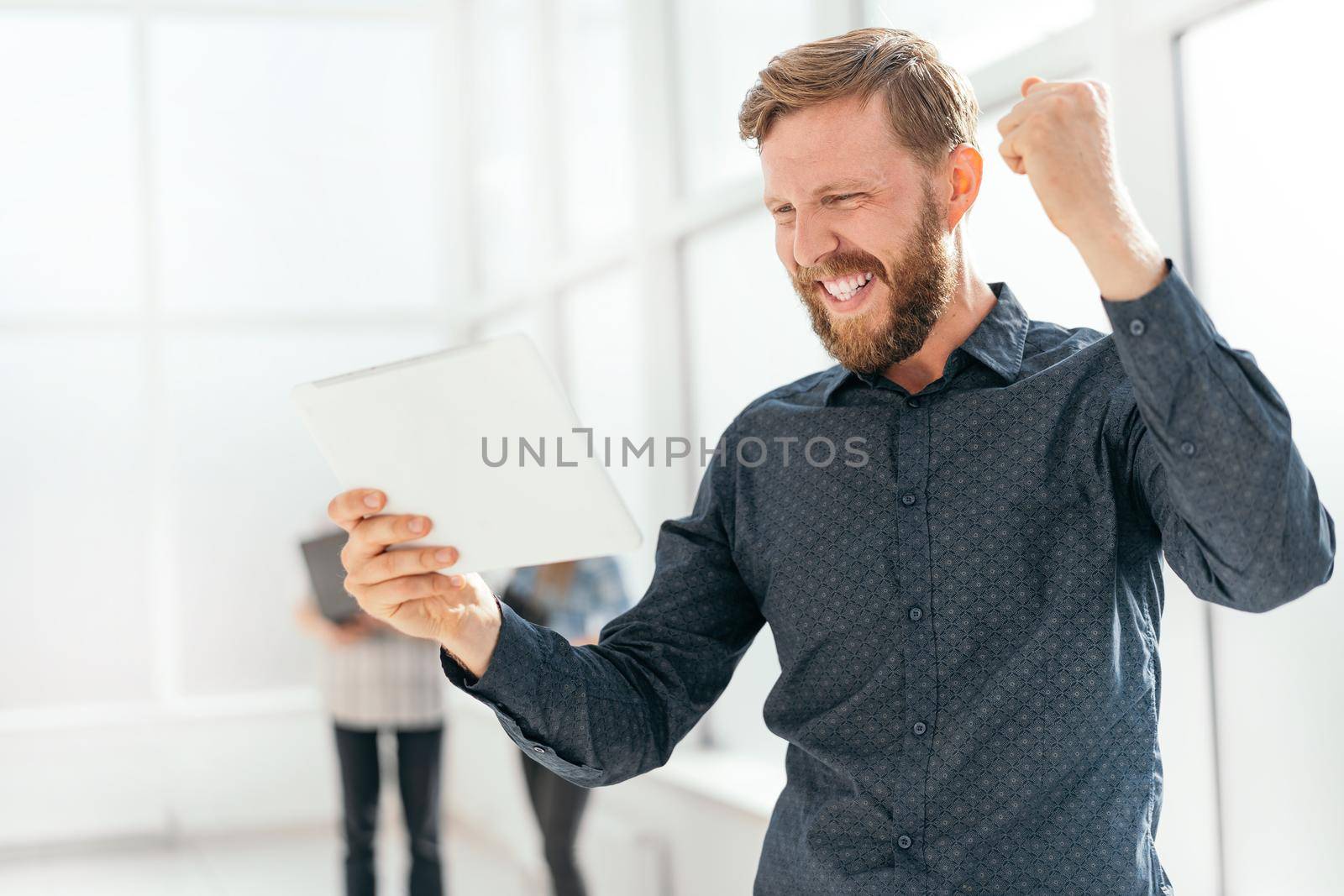 happy man getting good news on his email. photo with copy space