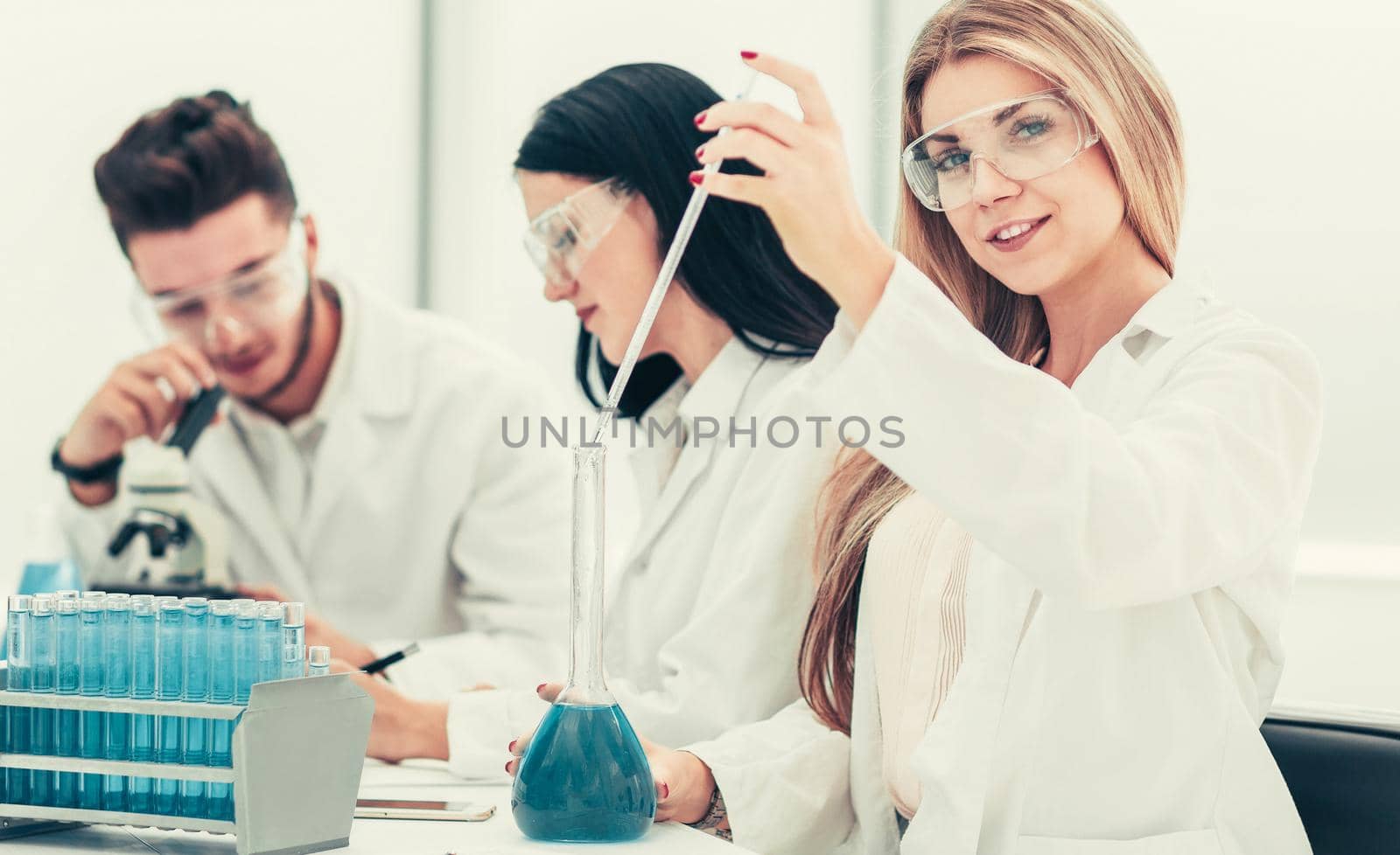 close up.a team of scientists conduct fluid research by SmartPhotoLab