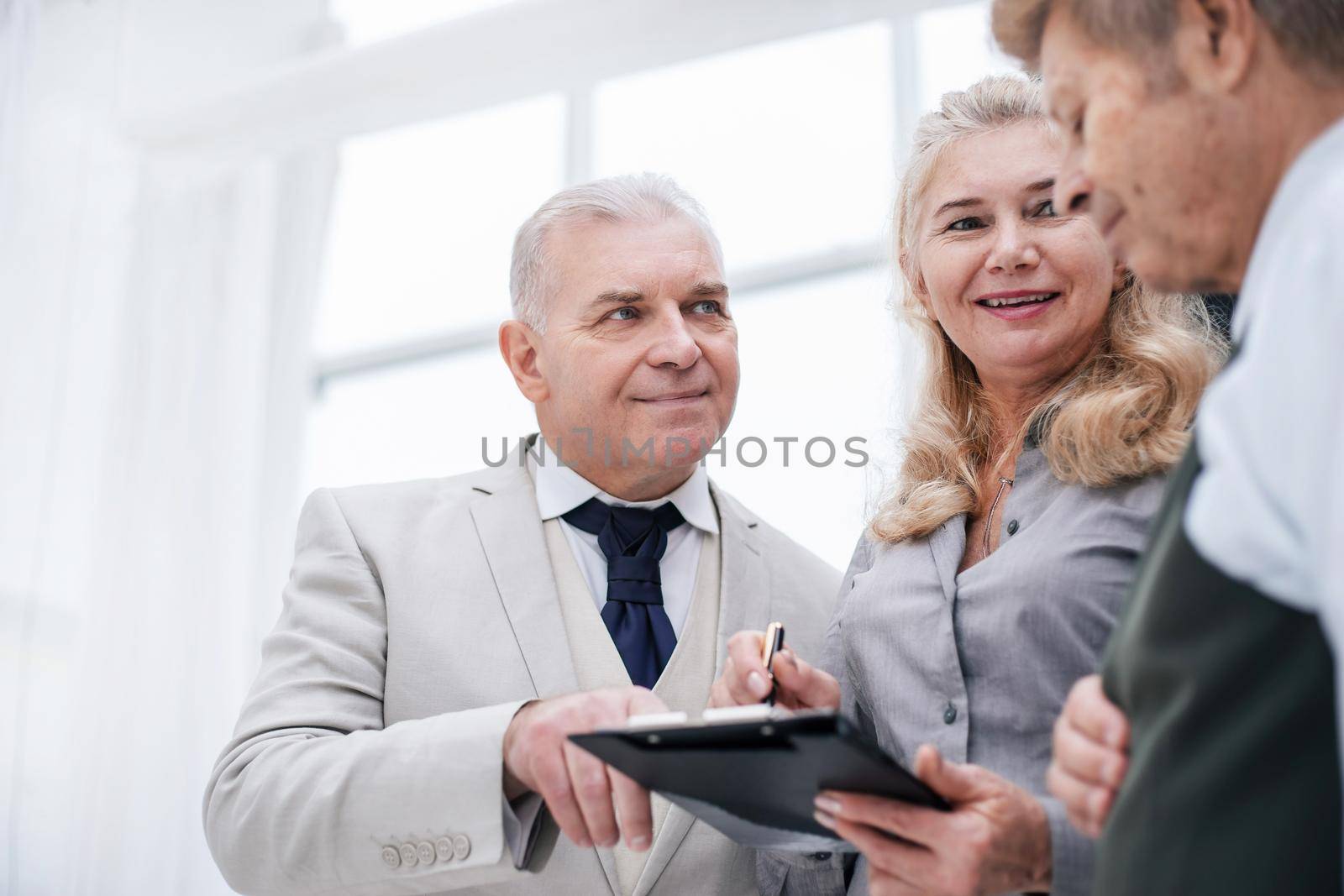 close up. group of employees discussing current tasks . office weekdays