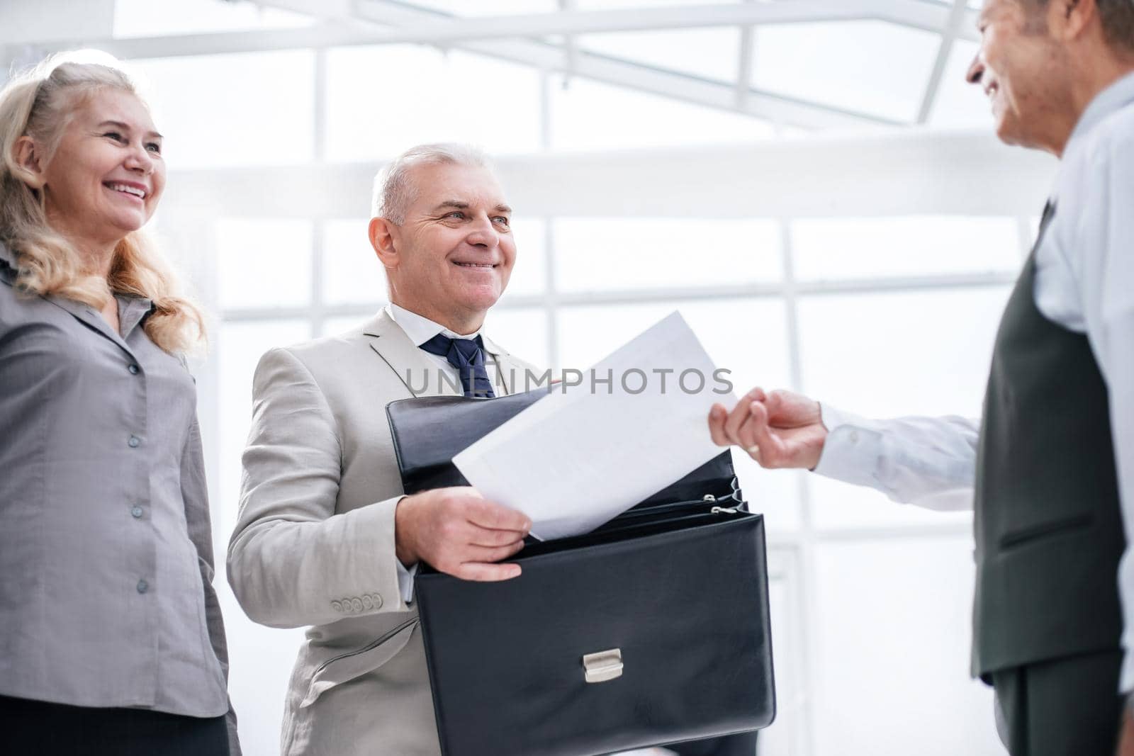 close up. businessman receiving document from Bank employee. business concept
