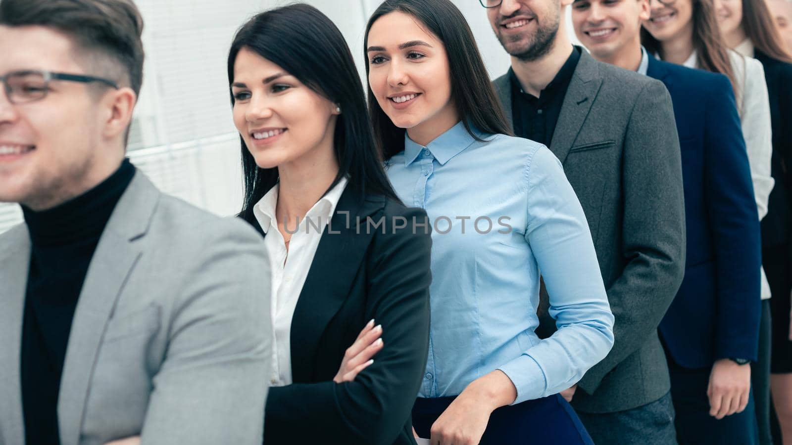 successful businessman standing ahead of his business team. the concept of teamwork