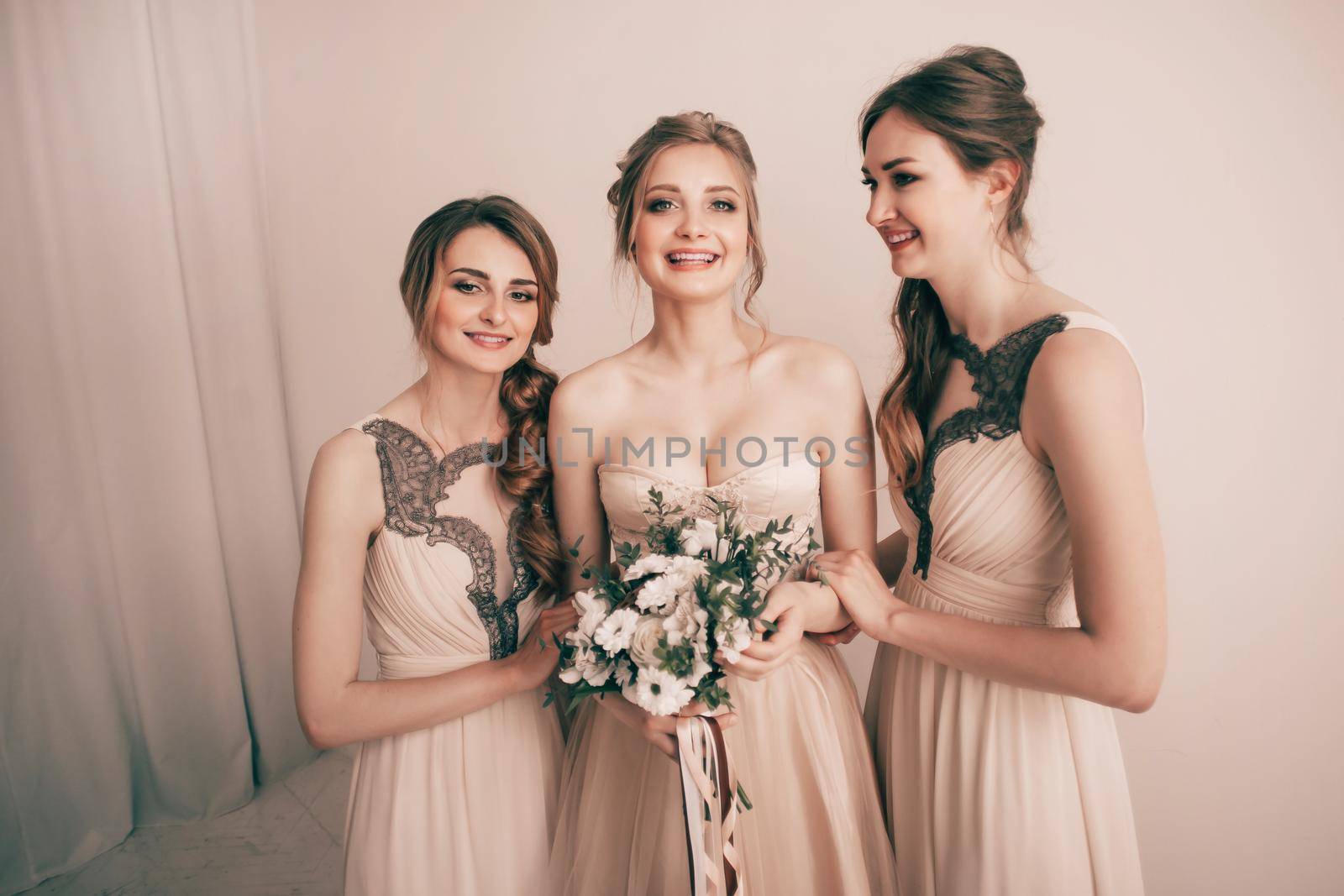 portrait of the bride with two girlfriends. holidays and events