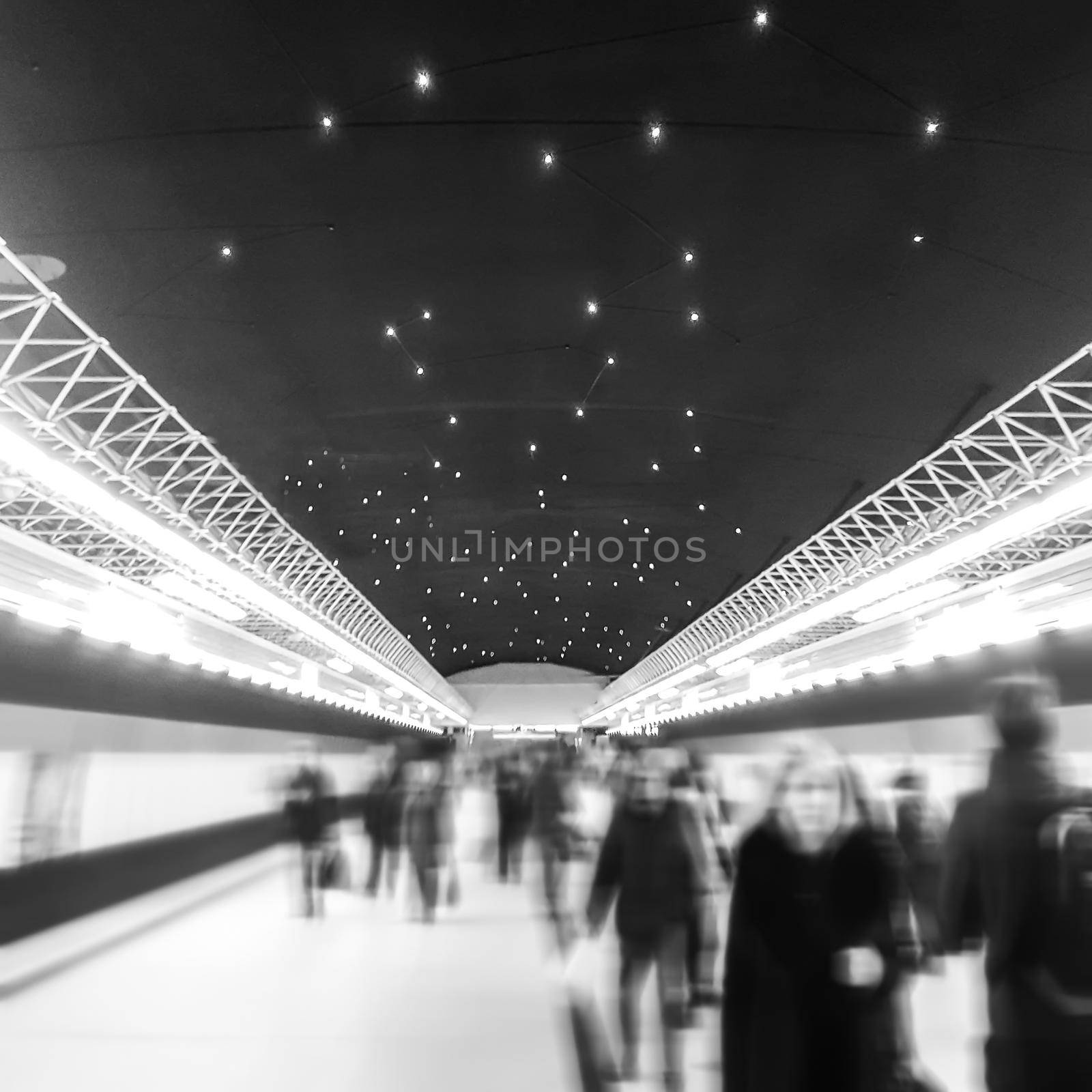 background image of people on the platform of the city station on Christmas evening. photo with copy space