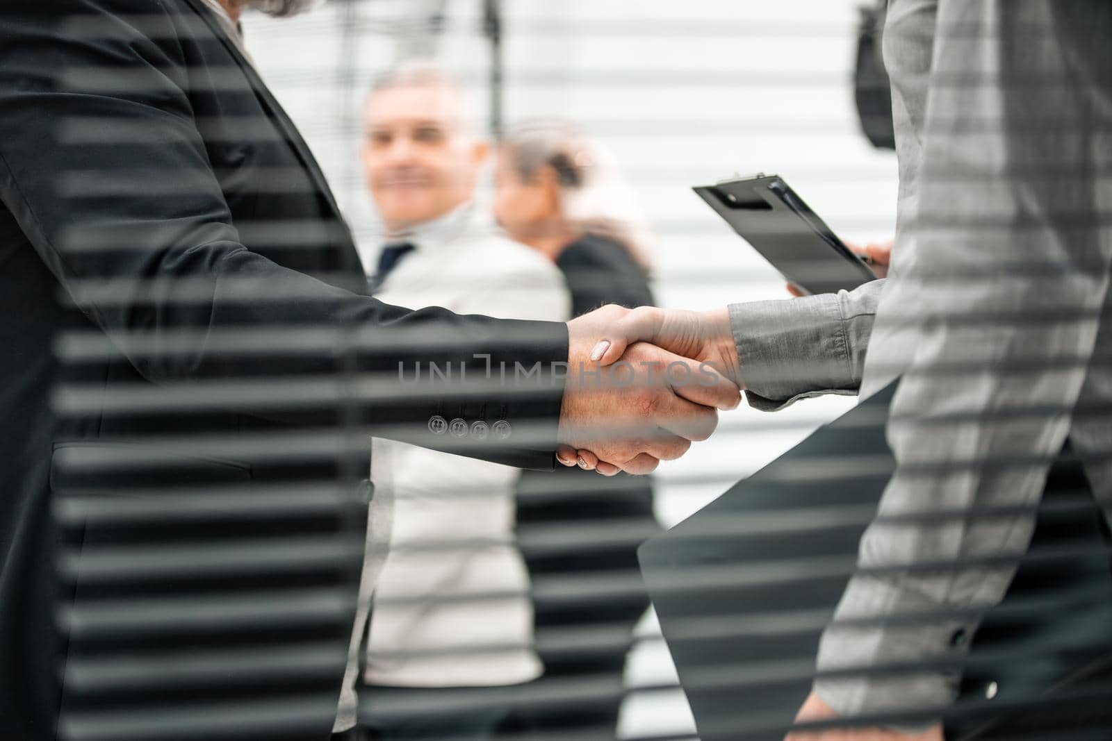 close up. business people shaking hands as a sign of cooperation. concept of partnership