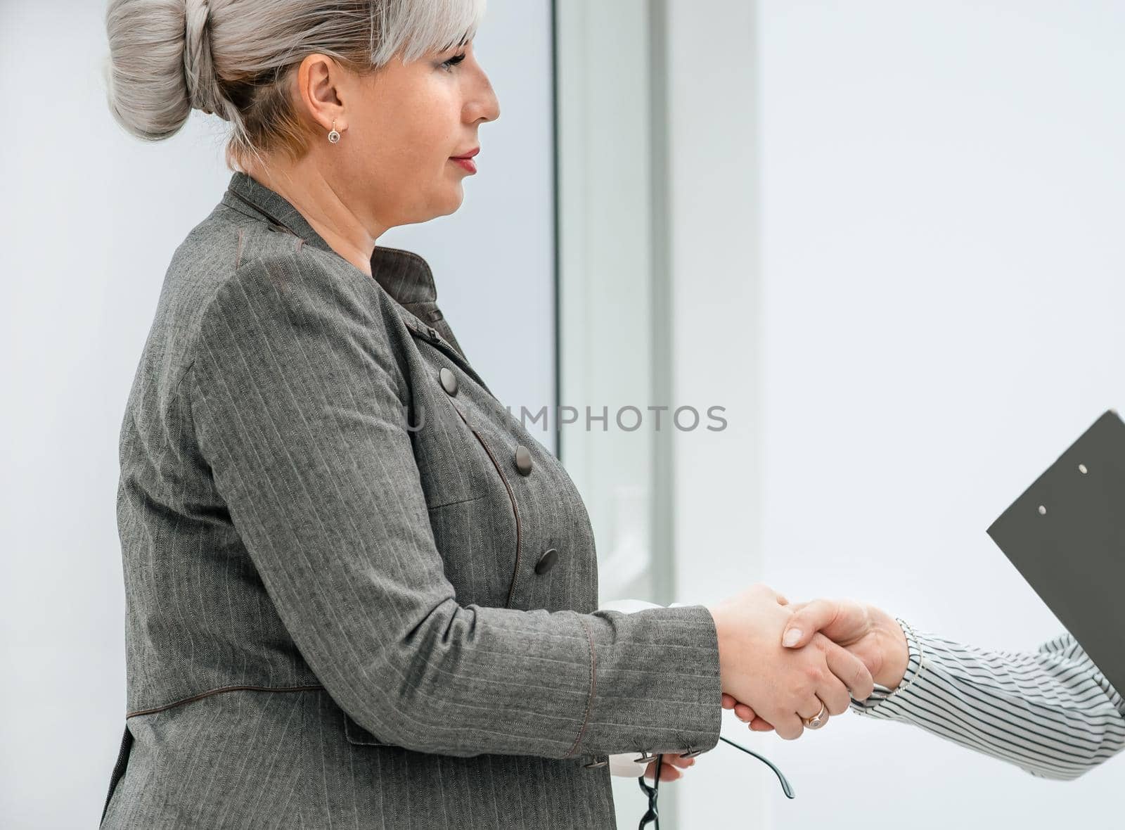 close up. two business women greet each other with a handshake. concept of partnership