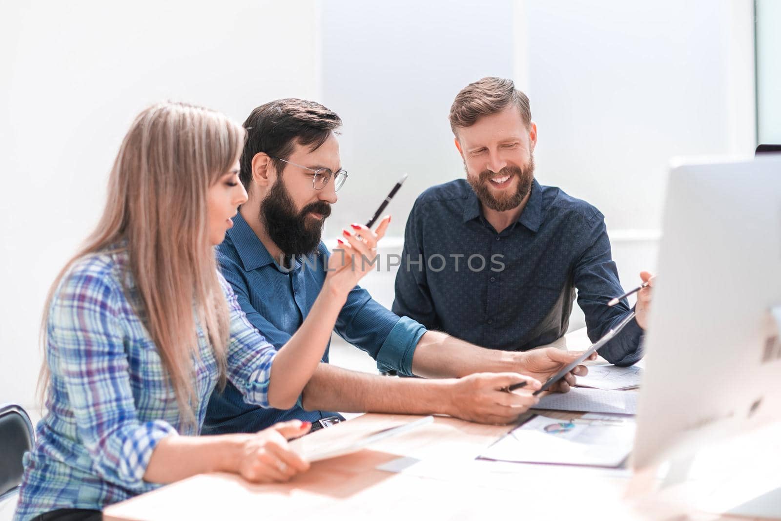 close up. creative business team sitting at the office table. the concept of teamwork