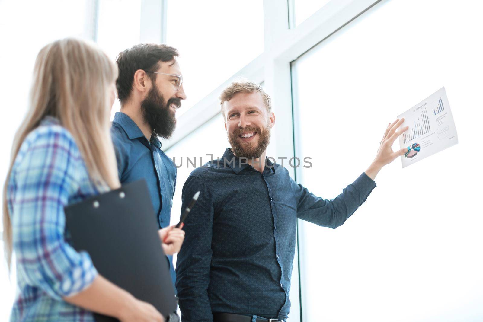 happy business team discussing the results of a new financial project . photo with copy space