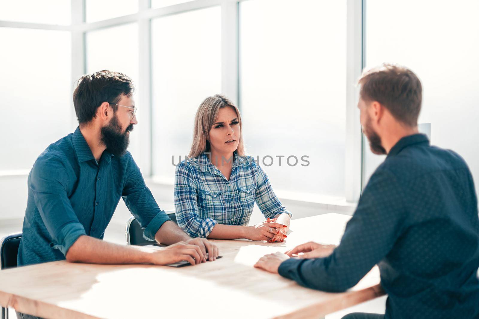 managers and job seeker sitting at the table during the interview. the concept of employment
