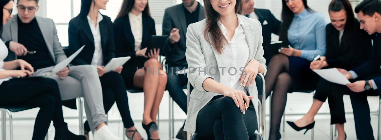 successful businesswoman and a group of leading experts in the conference room by SmartPhotoLab