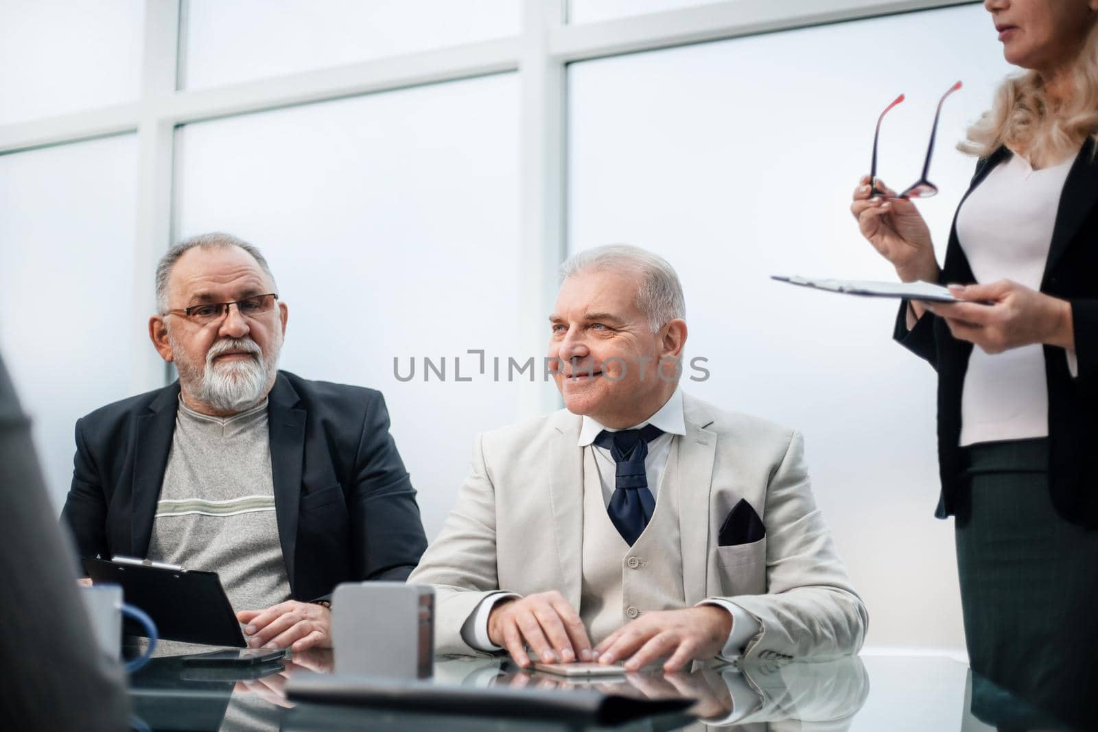 close up. business partners sitting at the negotiating table. business concept