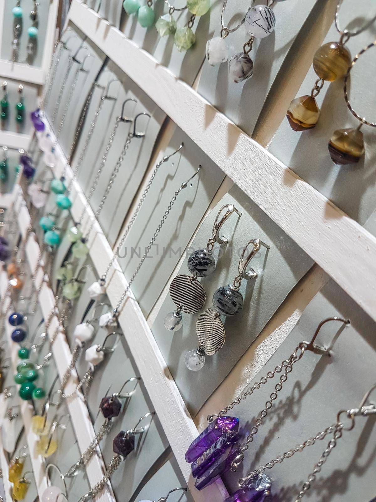 close up. Handmade earrings on the stand in a jewelry stor