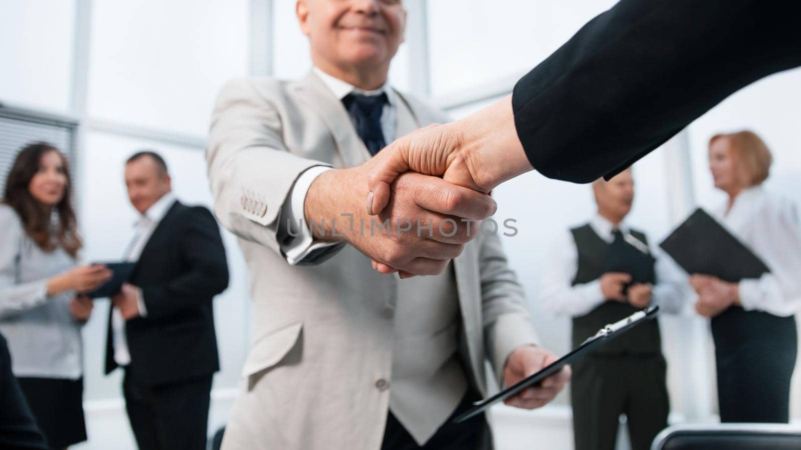 businessman confidently shaking hands with his business partner. the concept of cooperation