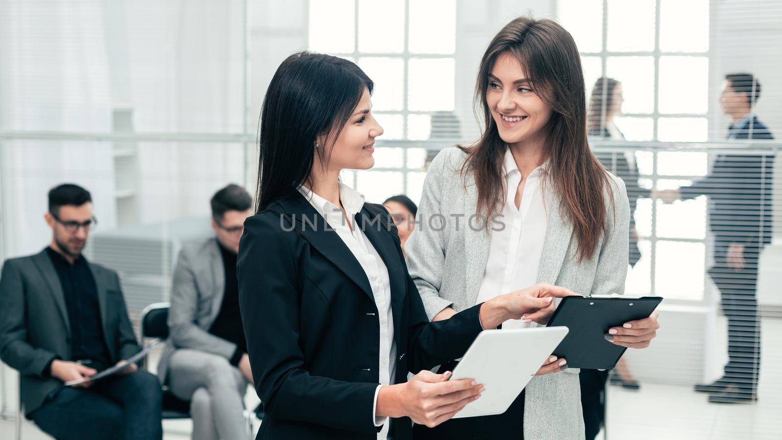 two business women discussing business documents in the office. business concept