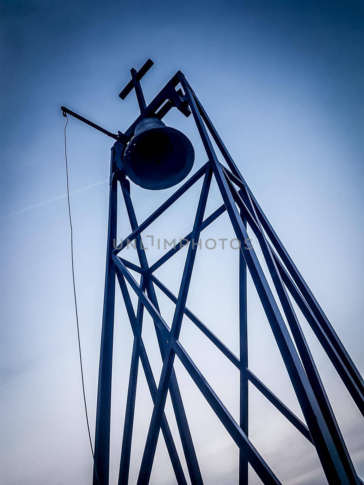 close up.the bell spire of the Catholic Church against the blue sky.