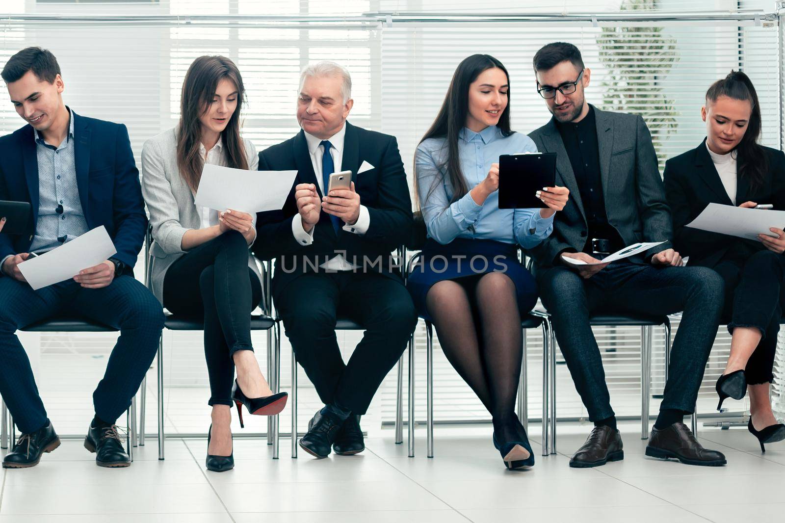 group of employees are preparing for the start of the workshop. photo with a copy of the space