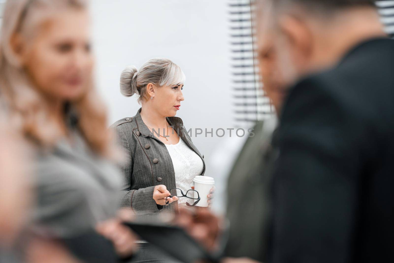 close up. business woman standing among her colleagues . business concept