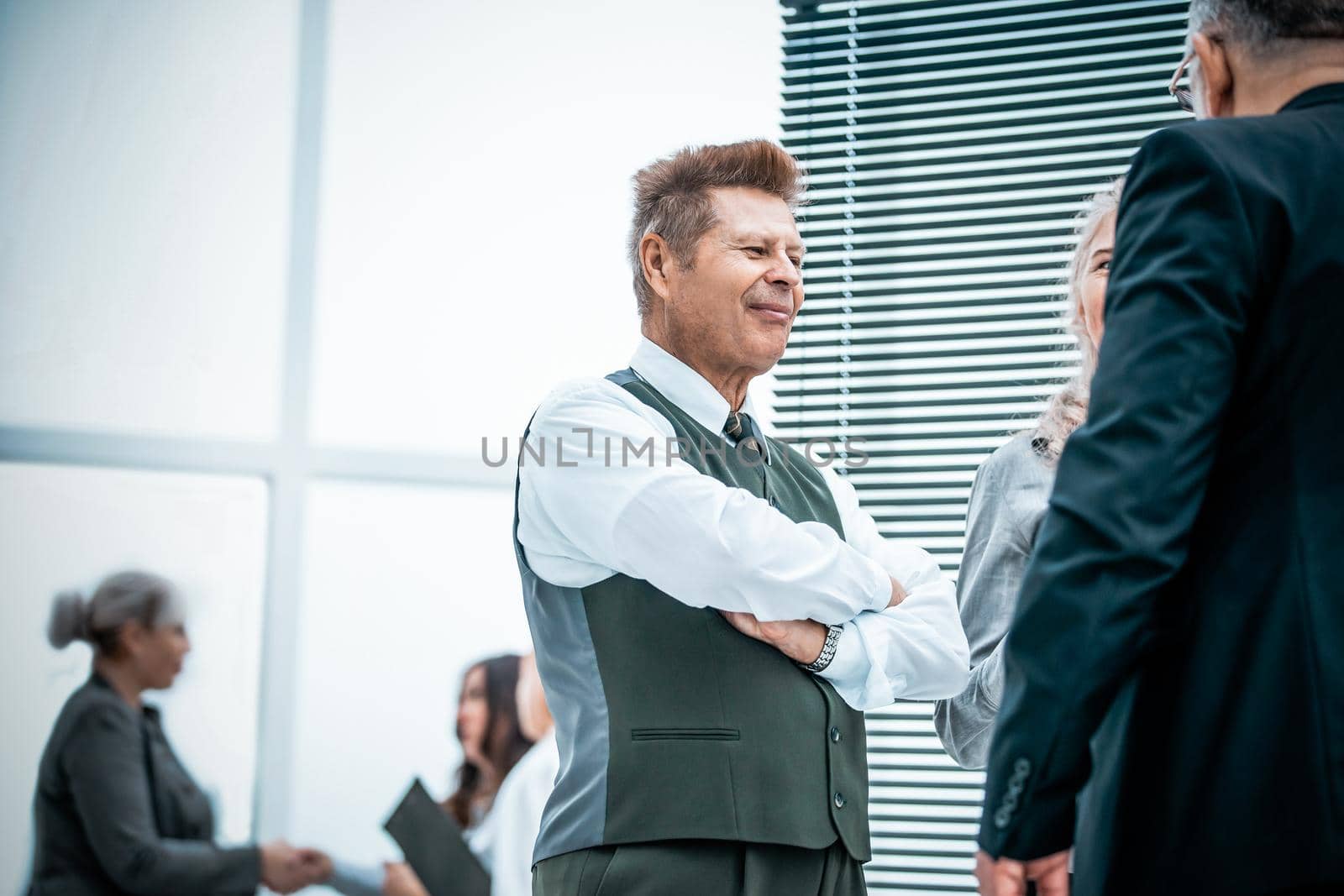 close up. serious employees discuss something standing in the office. office weekdays