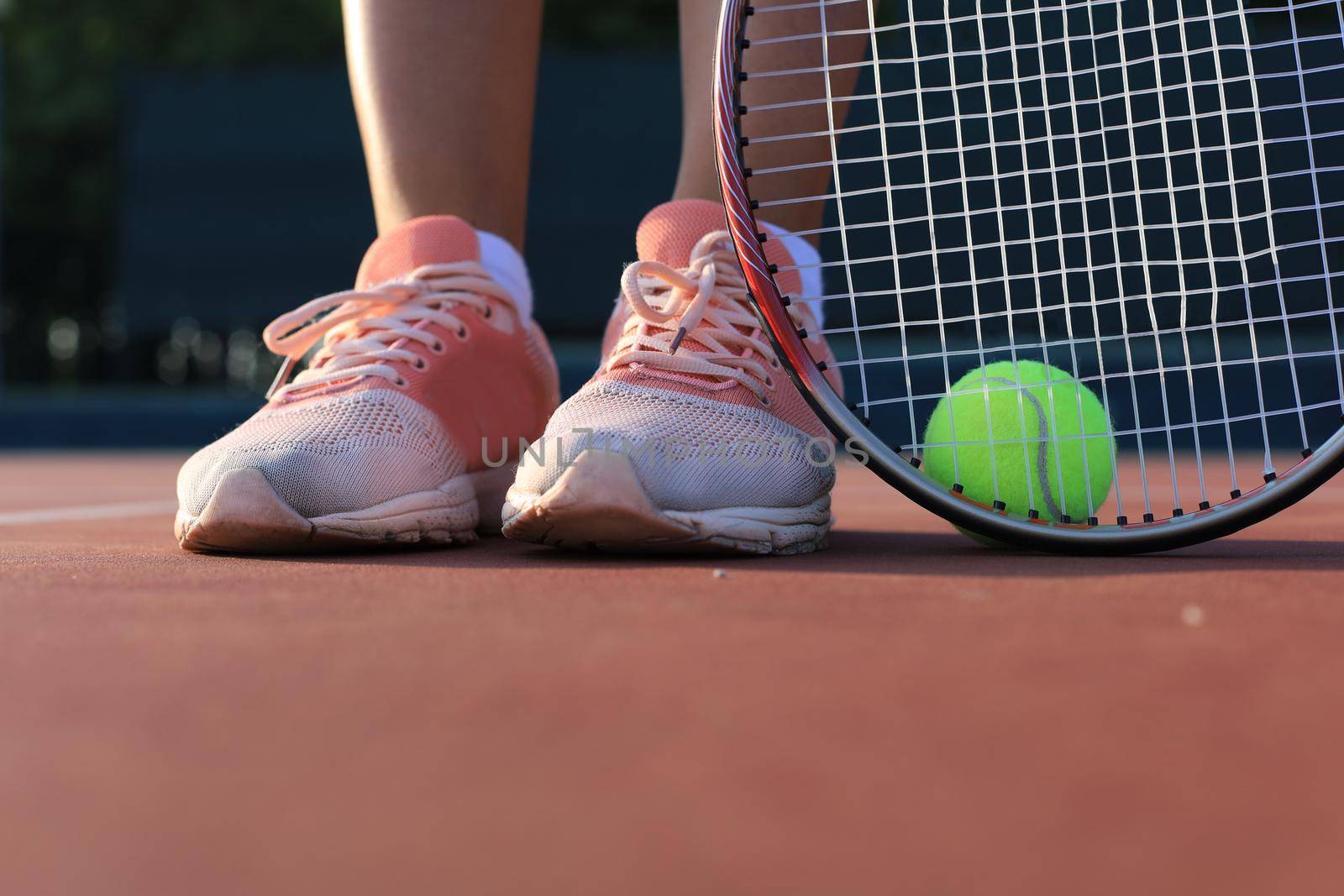 Tennis racket and the ball on tennis court