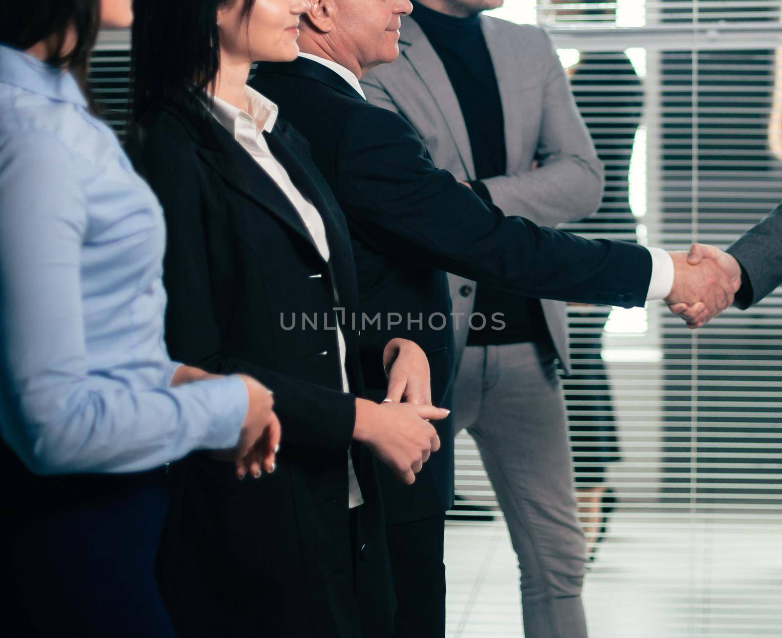 business partners shaking hands during the presentation. success concept