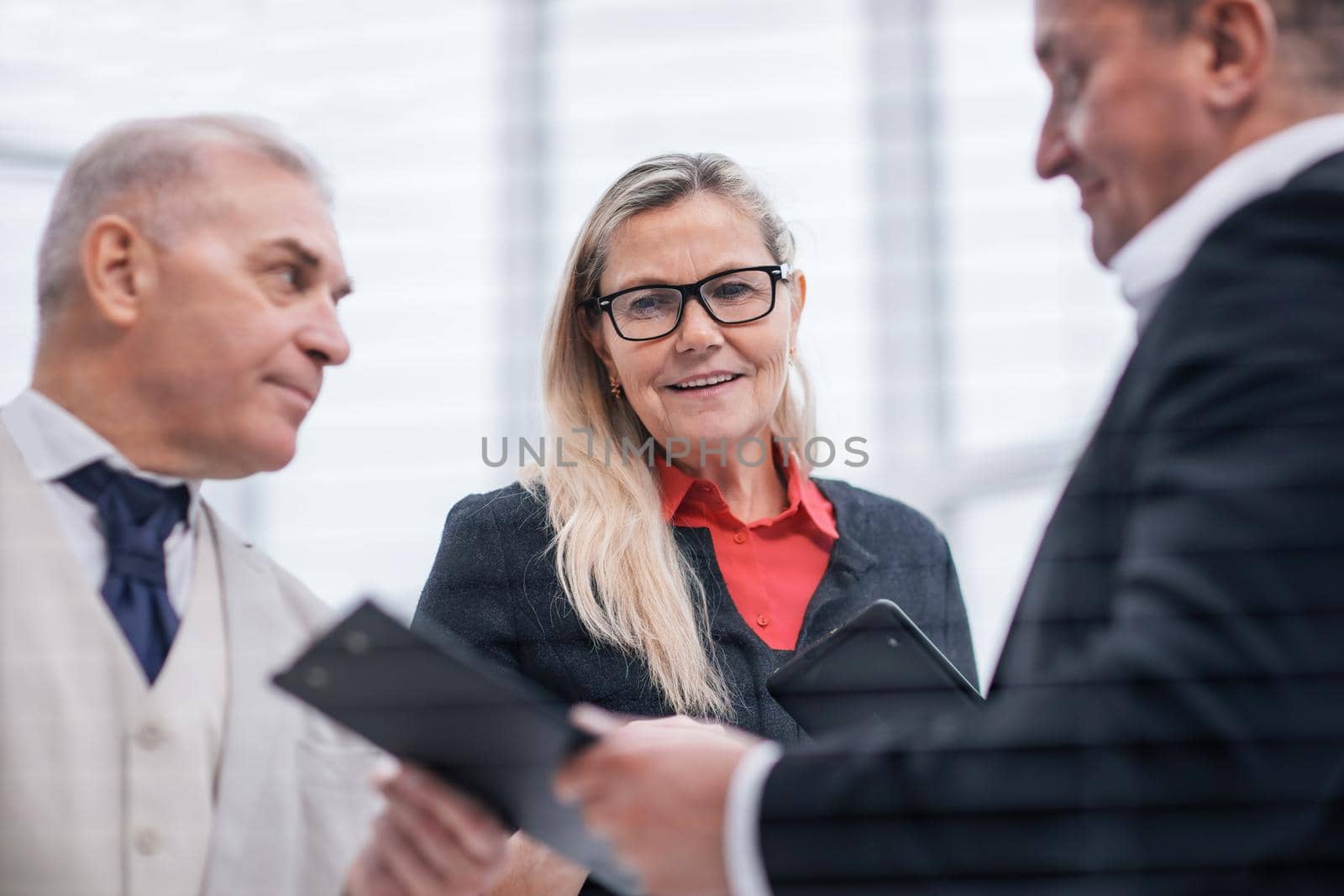 close up. project Manager discussing with employees working documents. office weekdays