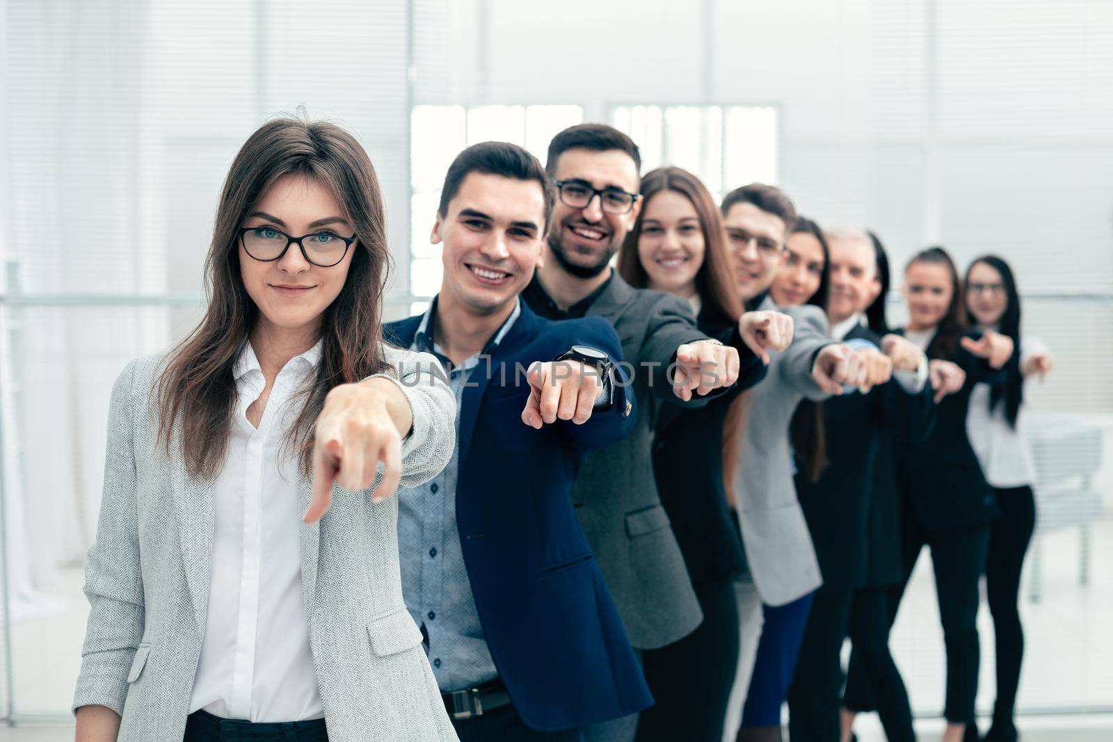 large group of young business people are pointing at you . the concept of choice