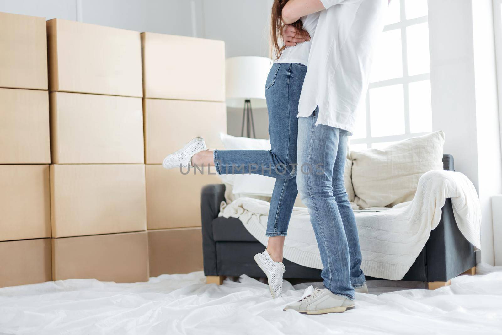 happy couple on the day of moving into their new apartment. photo with copy-space