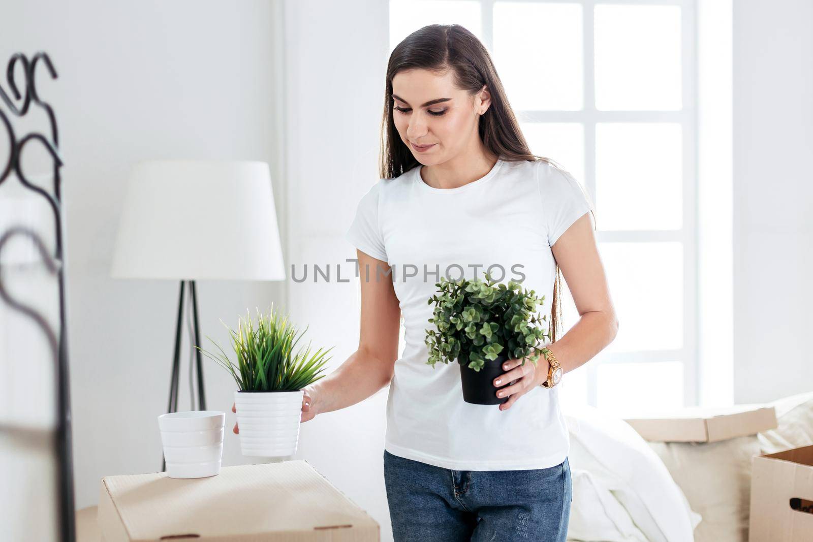 close up. young woman placing her things in a new apartment.