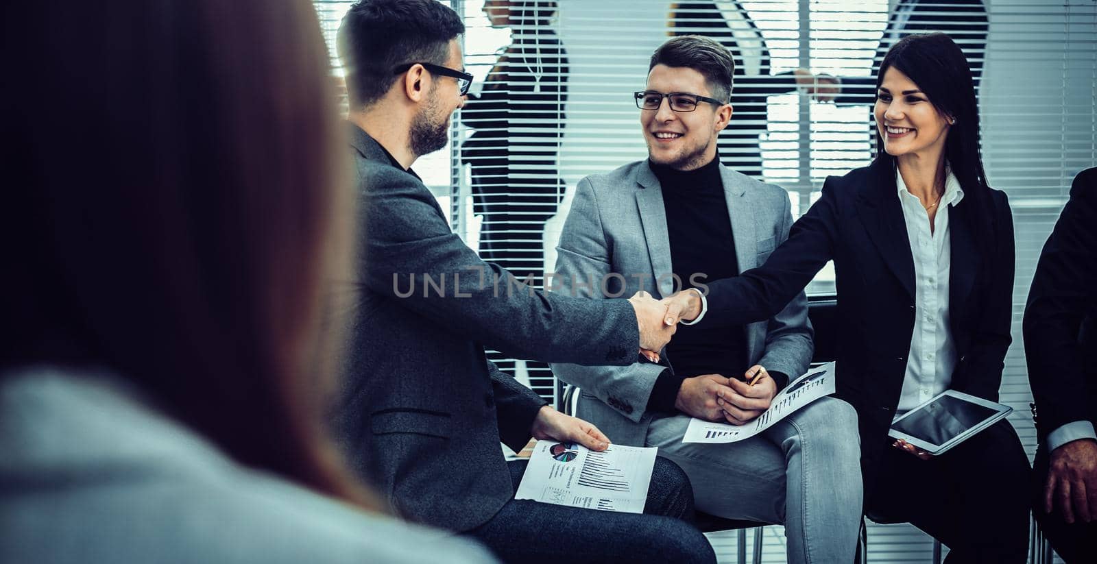 handshake of colleagues before the business seminar. concept of cooperation