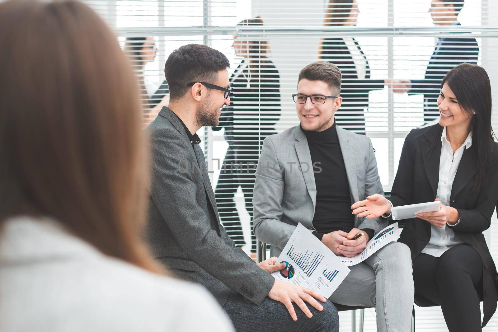 business colleagues discussing financial data in a conference room. business concept