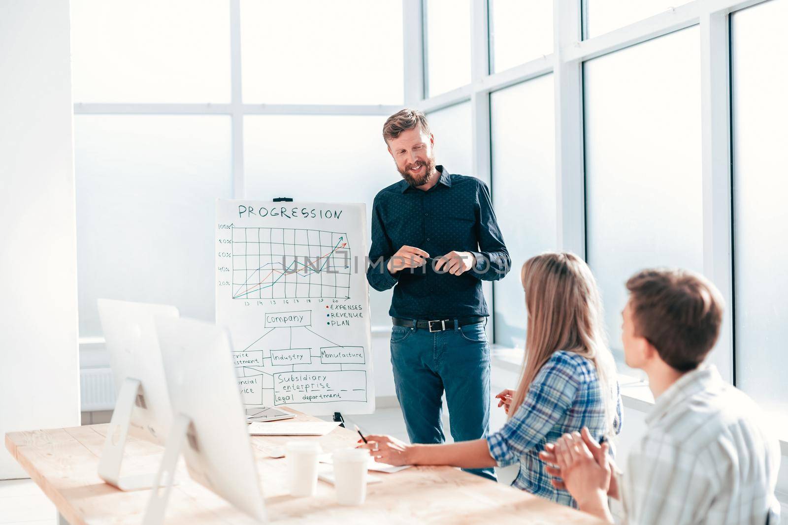 project Manager explaining to employees the new strategy of the company . photo with copy space